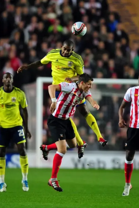 Framed Print : Battling for Supremacy: Marvin Elliott vs. Morgan Schneiderlin in Southampton vs. Bristol City Championship Clash (December 2011)