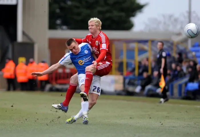 Framed Print : Battling for Supremacy: McGivern vs. Taylor in Peterborough United vs. Bristol City Football Match, 2012