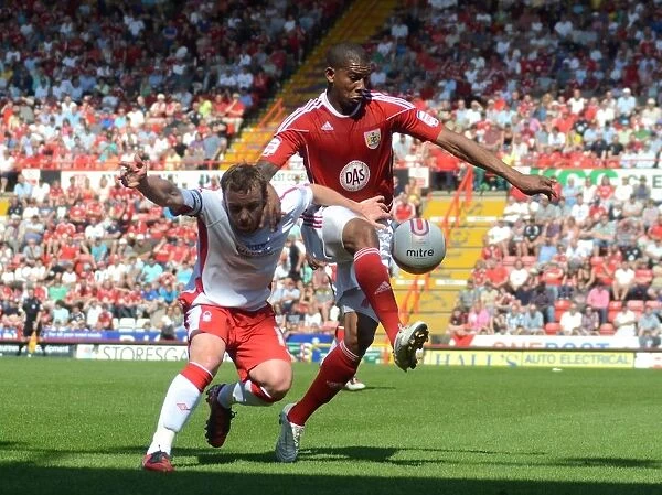 Battling for Supremacy: McKenna vs. Elliott in the Championship Clash between Bristol City and Nottingham Forest (25 / 04 / 2011)