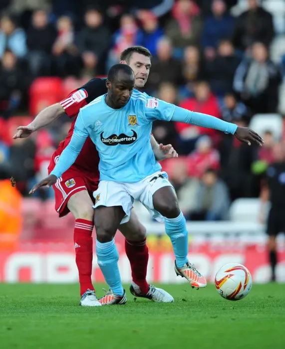 Framed Print : Battling for Supremacy: McManus vs. Aluko in the Championship Clash between Bristol City and Hull City