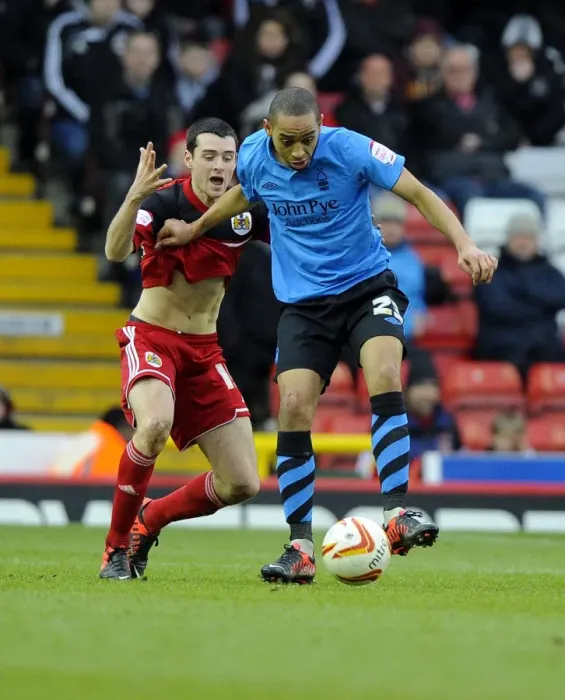 Framed Print : Battling for Supremacy: Moloney vs. Blackstock in the Npower Championship Clash between Bristol City and Nottingham Forest Framed Print : Battling for Supremacy: Moloney vs. Blackstock in the Npower Championship Clash between Bristol City and Nottingham Forest