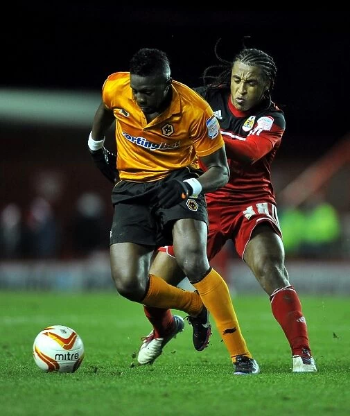 Battling for Supremacy: Neil Danns vs. Bakary Sako in the Championship Clash between Bristol City and Wolverhampton Wanderers
