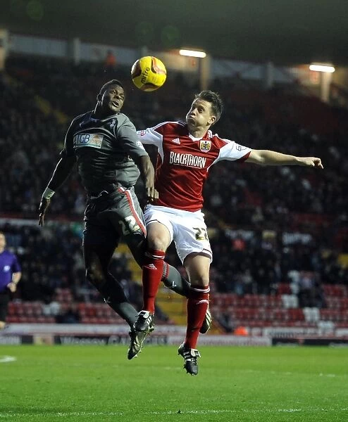 Battling for Supremacy: Nicky Shorey vs. Kieran Agard in the Height of the Air Battle at Ashton Gate