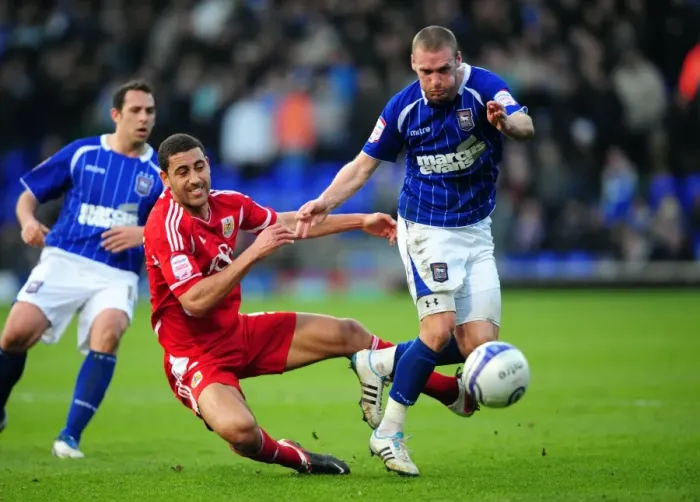 Framed Print : Battling for Supremacy: Nyatanga vs. Leadbitter in Ipswich Town vs. Bristol City Football Match, 2012 Framed Print : Battling for Supremacy: Nyatanga vs. Leadbitter in Ipswich Town vs. Bristol City Football Match, 2012