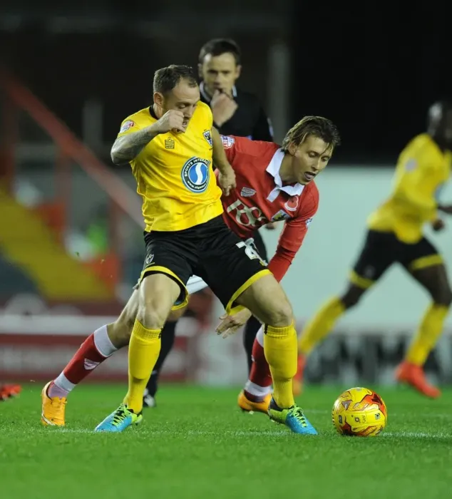 Framed Print : Battling for Supremacy: Osborne vs. Fuller in the Johnstone's Paint Trophy Clash between Bristol City and AFC Wimbledon