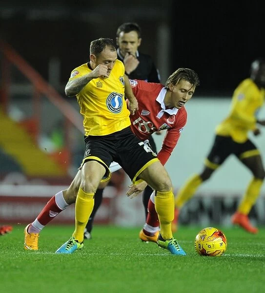 Battling for Supremacy: Osborne vs. Fuller in the Johnstone's Paint Trophy Clash between Bristol City and AFC Wimbledon