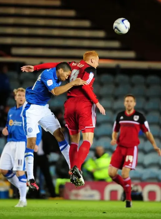 Framed Print : Battling for Supremacy: Ryan Taylor vs. Nat Knight-Percival in Peterborough United vs. Bristol City Championship Clash Framed Print : Battling for Supremacy: Ryan Taylor vs. Nat Knight-Percival in Peterborough United vs. Bristol City Championship Clash