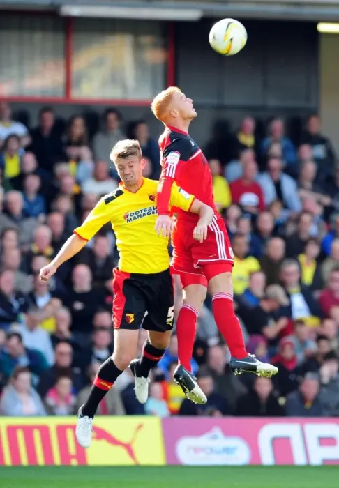 Framed Print : Battling for Supremacy: Ryan Taylor vs. Neuton in the Championship Clash between Watford and Bristol City