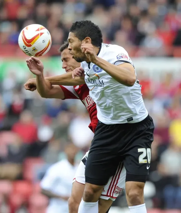 Framed Print : Battling for Supremacy: Sam Baldock vs. Nat Knight-Percival in the Sky Bet League One Clash between Bristol City and Peterborough United