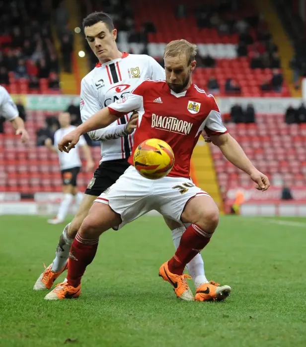 Framed Print : Battling for Supremacy: Simon Gillett vs. Shaun Williams in the Heat of Bristol City vs. MK Dons Rivalry