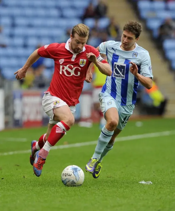 Framed Print : Battling for Supremacy: Wade Elliott vs. Shaun Miller in Bristol City's Sky Bet League One Clash at Ricoh Arena Framed Print : Battling for Supremacy: Wade Elliott vs. Shaun Miller in Bristol City's Sky Bet League One Clash at Ricoh Arena