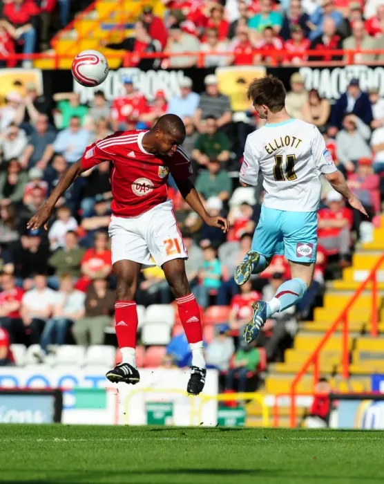 Framed Print : Battling for Supremacy: Wade Elliott vs. Kalifa Cisse in the 2011 Championship Clash between Bristol City and Burnley Framed Print : Battling for Supremacy: Wade Elliott vs. Kalifa Cisse in the 2011 Championship Clash between Bristol City and Burnley
