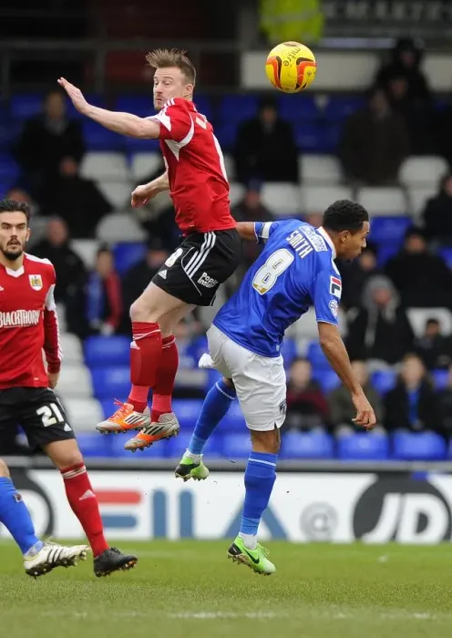 Framed Print : Battling for Supremacy: Wade Elliott vs. Korey Smith in Oldham Athletic vs. Bristol City Football Clash Framed Print : Battling for Supremacy: Wade Elliott vs. Korey Smith in Oldham Athletic vs. Bristol City Football Clash