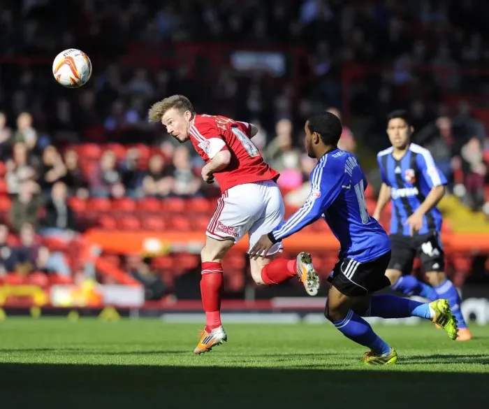 Framed Print : Battling for Supremacy: Wade Elliott vs. Louis Thompson in the Intense Rivalry of Bristol City vs. Swindon Town
