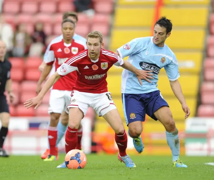 Framed Print : Battling for Supremacy: Wagstaff vs. Howell in the FA Cup Clash between Bristol City and Dagenham and Redbridge