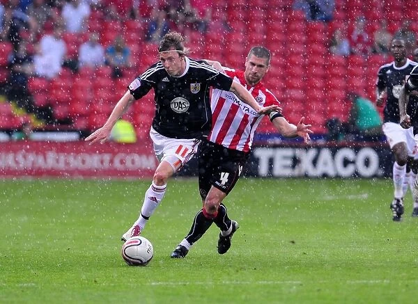 Battling for Supremacy: Woolford vs. Montgomery in the Championship Clash between Sheffield United and Bristol City (April 2011)