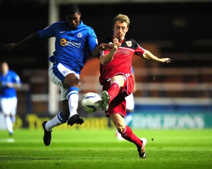 Framed Print : Battling for Supremacy: Woolford vs. Little in Peterborough United vs. Bristol City Championship Clash