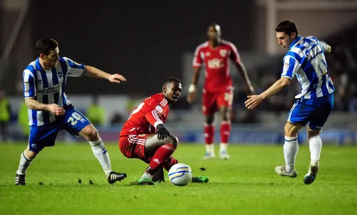 Framed Print : Battling for Supremacy: Yannick Bolasie vs. Romain Vincelot and Matthew Sparrow in the Championship Clash between Brighton and Bristol City - 14 / 01 / 2012 Framed Print : Battling for Supremacy: Yannick Bolasie vs. Romain Vincelot and Matthew Sparrow in the Championship Clash between Brighton and Bristol City - 14 / 01 / 2012