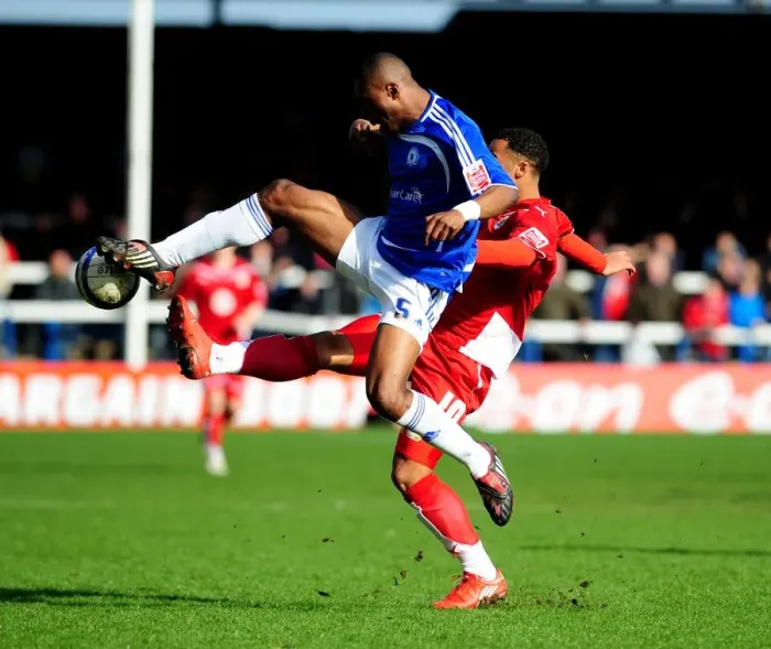 Framed Print : Battling for Supremacy: Zakuani vs. Maynard in the Peterborough vs. Bristol City Championship Clash (March 2010)