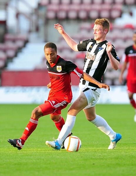 Bobby Reid in Action: A Thrilling Pre-Season Encounter at Dunfermline Athletic's East End Park