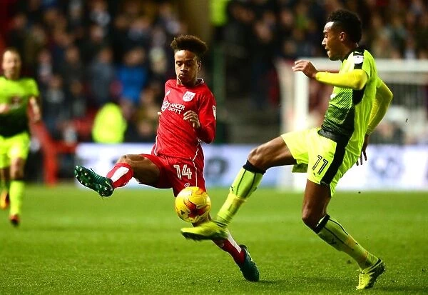 Bobby Reid Closes In: A Tight Battle Between Bristol City's Reid and Reading's Obita at Ashton Gate, 2017