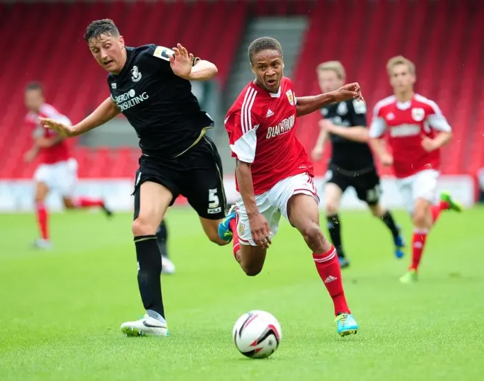 Framed Print : Bobby Reid Sprints Past Tommy Elphick: A Thrilling Moment from Bristol City's Pre-Season Clash with Bournemouth (27 / 03 / 2013)