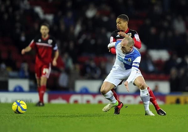 Bobby Reid Steals the Ball from Danny Murphy: A Pivotal Moment in Blackburn Rovers vs. Bristol City FA Cup Match, January 2013