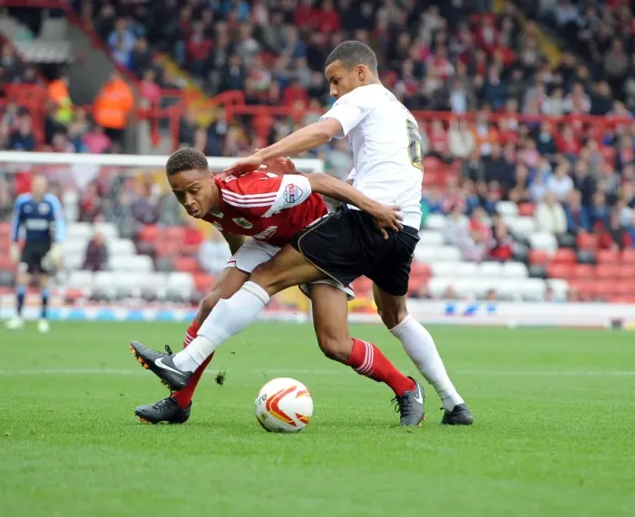 Framed Print : Bobby Reid vs Craig Eastmond: A Football Rivalry Unfolds in Sky Bet League One - Bristol City vs Colchester United Framed Print : Bobby Reid vs Craig Eastmond: A Football Rivalry Unfolds in Sky Bet League One - Bristol City vs Colchester United