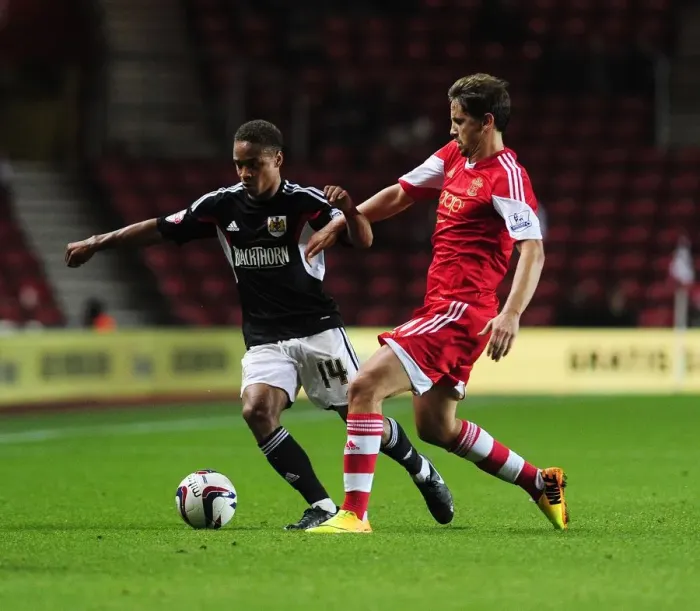 Framed Print : Bobby Reid vs. Gastón Ramirez: Intense Clash in Southampton vs. Bristol City Football Match, September 2013