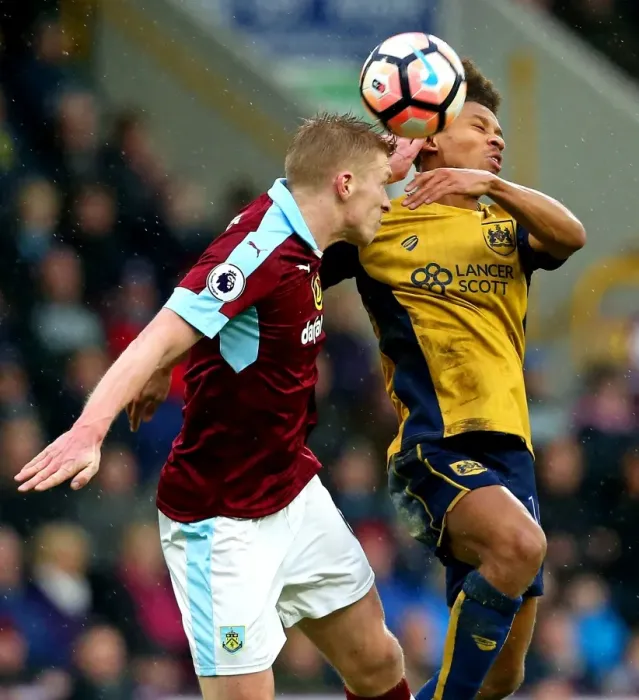 Framed Print : Bobby Reid vs Scott Arfield: Clash at Turf Moor, FA Cup Fourth Round Framed Print : Bobby Reid vs Scott Arfield: Clash at Turf Moor, FA Cup Fourth Round