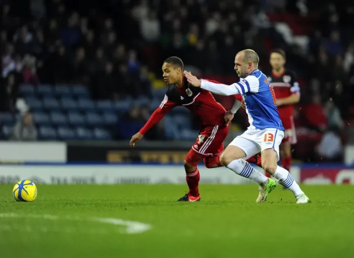 Framed Print : Bobby Reid's Game-Changing Moment: Stealing the Ball from Danny Murphy in the FA Cup Match between Blackburn Rovers and Bristol City, January 2013