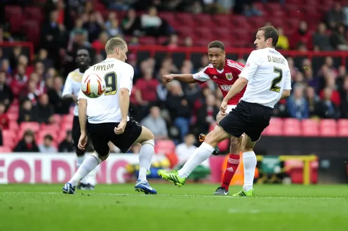 Framed Print : Bobby Reid's Shot at Glory: Bristol City vs Colchester United, 2013