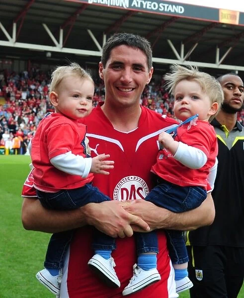 Bradley Orr of Bristol City Celebrates with His Twins after Championship Match vs. Derby County (April 2010)