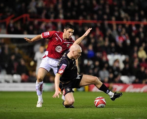 Bradley Orr vs. Emil Hallfredsson: Intense Battle for the Ball in Bristol City vs. Barnsley Championship Match, 2010