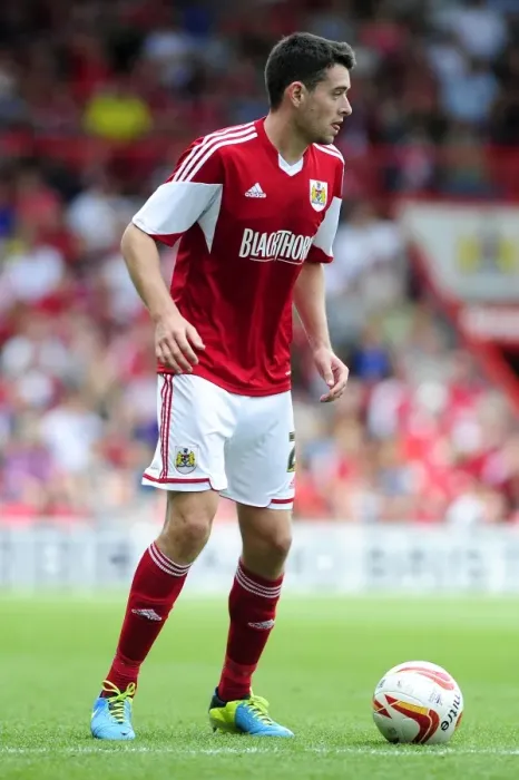 Framed Print : Brendan Moloney vs Bradford City: Intense Face-off in the Sky Bet League One Clash at Ashton Gate (August 2013)
