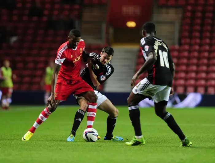 Framed Print : Brendan Moloney vs. Guilherme do Prado: Clash at St. Mary's Stadium - Southampton vs. Bristol City, 2013