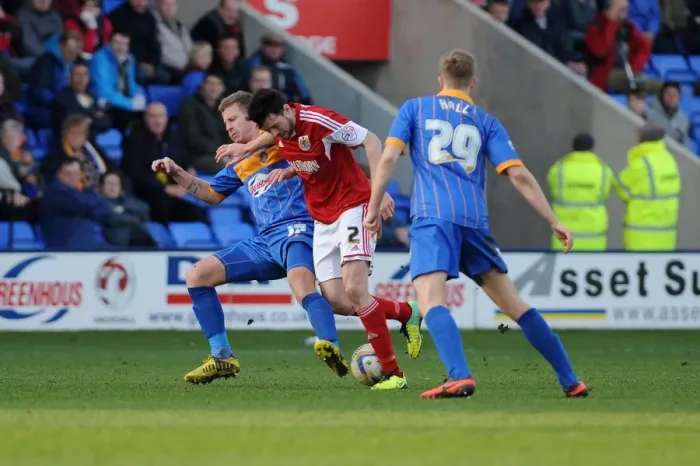 Framed Print : Brendan Moloney vs Paul Parry: Intense Rivalry in Shrewsbury Town vs Bristol City Football Match, March 2014 Framed Print : Brendan Moloney vs Paul Parry: Intense Rivalry in Shrewsbury Town vs Bristol City Football Match, March 2014