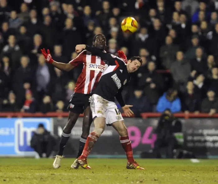Framed Print : Brentford vs. Bristol City: Intense Battle for the Ball between Clayton Donaldson and Greg Cunningham Framed Print : Brentford vs. Bristol City: Intense Battle for the Ball between Clayton Donaldson and Greg Cunningham
