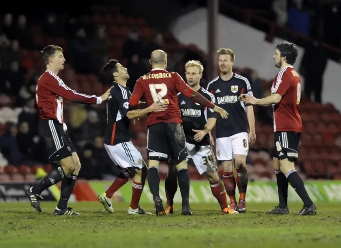 Framed Print : Brentford vs. Bristol City: Intense Moment Between McCormack and Elliott Framed Print : Brentford vs. Bristol City: Intense Moment Between McCormack and Elliott