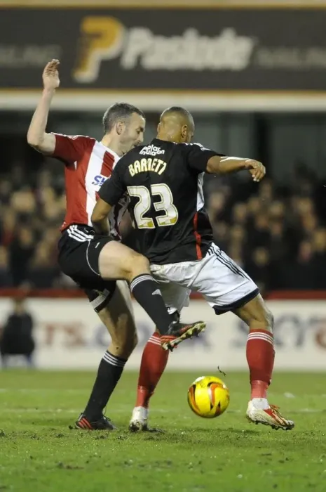 Framed Print : Brentford vs. Bristol City: Tyrone Barnett vs. Kevin O'Connor Clash in Sky Bet League One