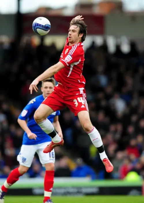 Framed Print : Brett Pitman Soars High: Portsmouth vs. Bristol City Football Rivalry, 17-03-2012