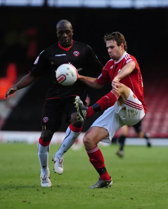 Framed Print : Brett Pitman Soars Over Nyal Bell-Noseworth: A Pivotal Moment in the 2010 Bristol City vs. Sheffield United Championship Clash