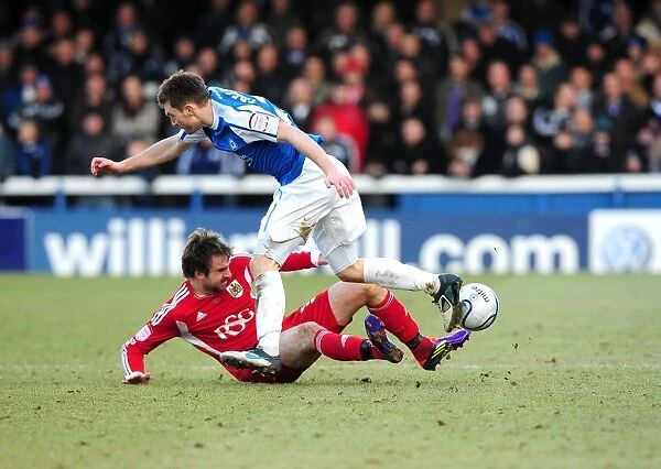 Brett Pitman Tackles Lee Frecklington: Intense Moment in Peterborough United vs. Bristol City Football Match, 2012