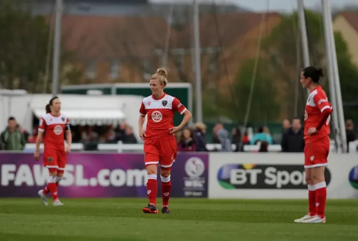 Framed Print : Bristol Academy Players Show Dejection After Going 2-0 Down Against Chelsea Ladies