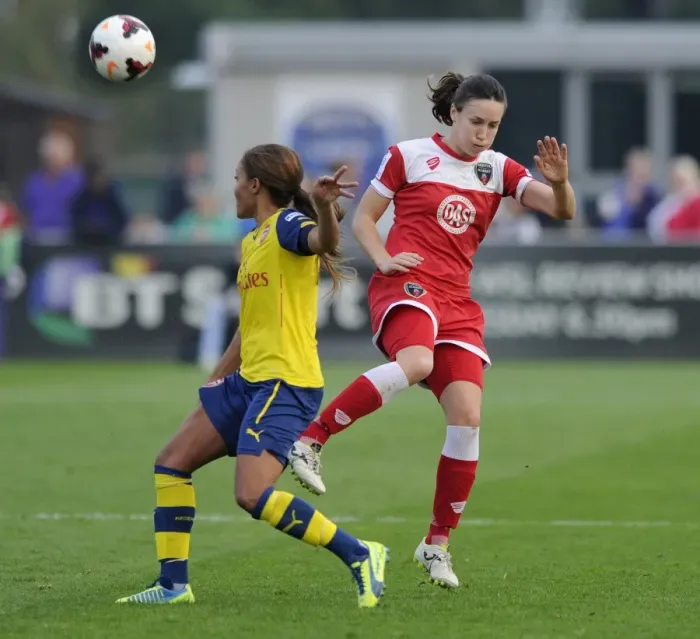 Framed Print : Bristol Academy vs Arsenal Ladies: Intense Moment as Corinne Yorston Faces Off Against Alex Scott