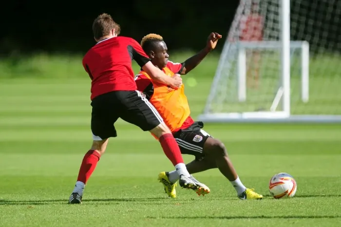 Framed Print : Bristol City Academy Training: Ridwan Oluwatobi Slides for the Ball Framed Print : Bristol City Academy Training: Ridwan Oluwatobi Slides for the Ball