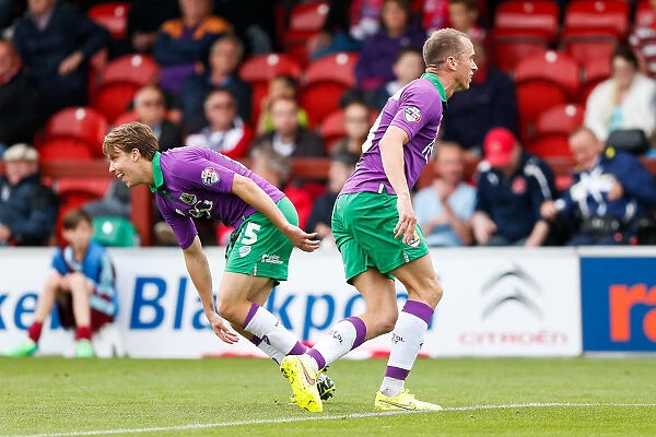 Bristol City Celebrate Goal: Luke Freeman and Aaron Wilbraham Rejoice for Kieran Agard's Score Against Fleetwood Town, 2014