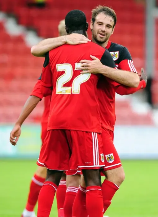 Framed Print : Bristol City Celebrates Double Strike: Albert Adomah and Brett Pitman Rejoice after Goals vs. Dunfermline Athletic (August 1, 2012)