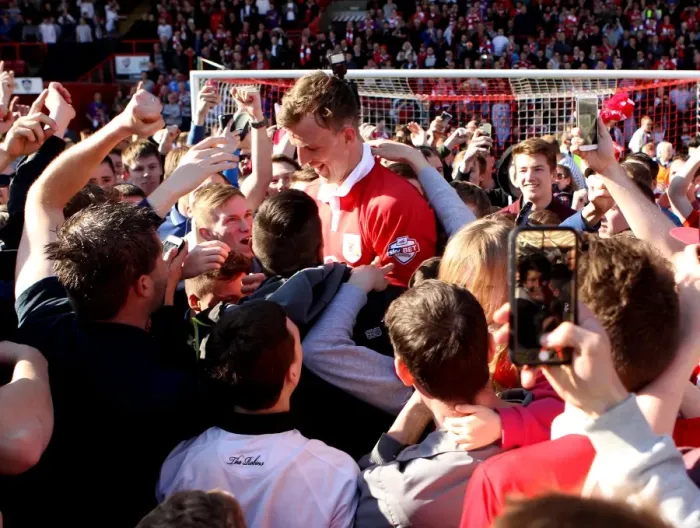 Framed Print : Bristol City Celebrates League One Title: Aden Flint Amidst Ecstatic Fans Framed Print : Bristol City Celebrates League One Title: Aden Flint Amidst Ecstatic Fans