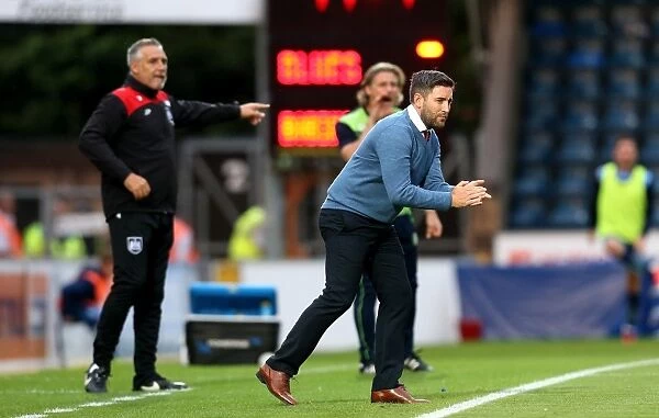 Bristol City Coaches Johnson and Pemberton Give Instructions from Touchline during Wycombe Wanderers vs. Bristol City EFL Cup Match